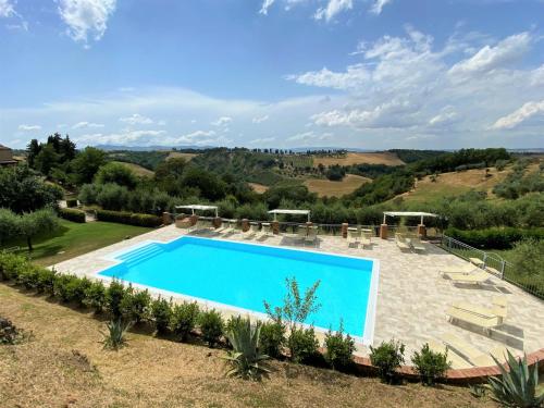 an image of a swimming pool in a villa at Apartment Stregaia-1 by Interhome in Montaperti