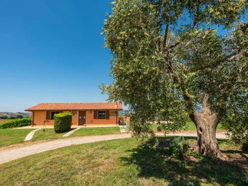 a house with a tree in front of it at Holiday Home Arancio by Interhome in Preselle