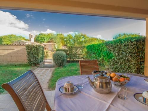 a table with a bowl of fruit on a patio at Apartment Thermae Apartment 25 by Interhome in Sorano