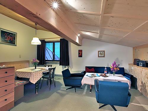 a kitchen and dining room with a table and chairs at Apartment Ainhauser-2 by Interhome in Rodund