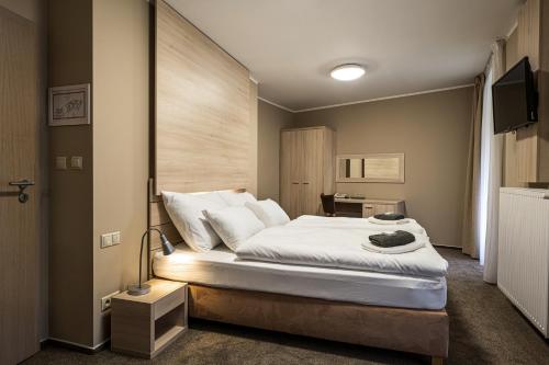 Säng eller sängar i ett rum på Horský hotel Lorkova vila