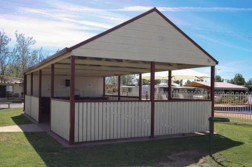 a pavilion with a roof on the grass at Sun Country Lifestyle Park in Mulwala