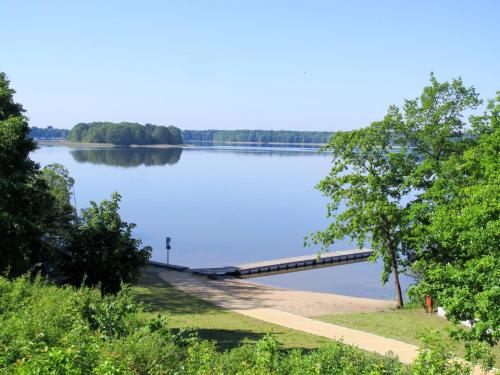 a bridge over a lake with trees in the background at Holiday Home Useriner See-4 by Interhome in Userin