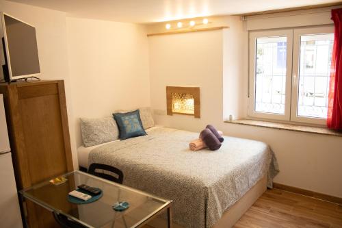 Katil atau katil-katil dalam bilik di Malagueña Salerosa "Apartamento - estudio con terraza" En casa típica de 1 a 4 dormitorios