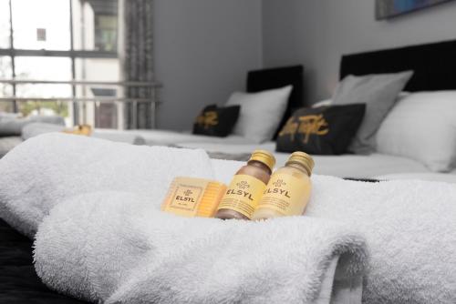 two bottles of essential oils sitting on a white towel at The Berwyn – Berwyn House in Wrexham