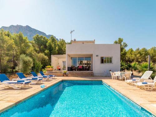 a villa with a swimming pool and a house at Villa Betlem by Interhome in Colonia de Sant Pere