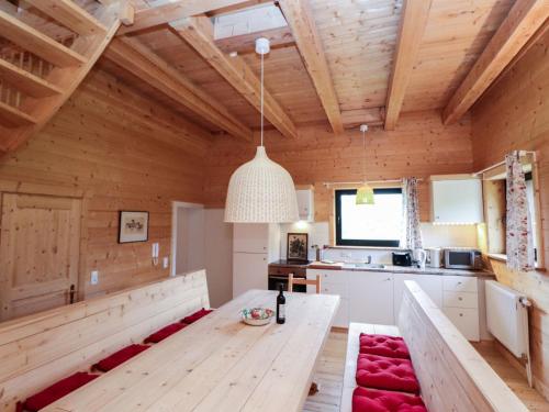 a kitchen and dining room with a wooden ceiling at Apartment Bärenhöhle - Top 6 by Interhome in Grünau im Almtal