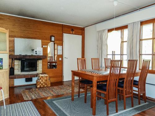 a dining room with a wooden table and chairs at Holiday Home Saariseläntie 8 a 1 by Interhome in Saariselka
