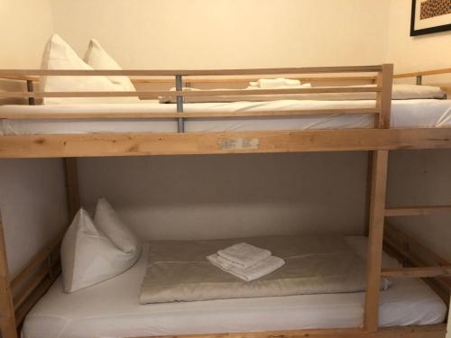 a bunk room with three bunk beds in it at Appartements Domizil in Kaprun