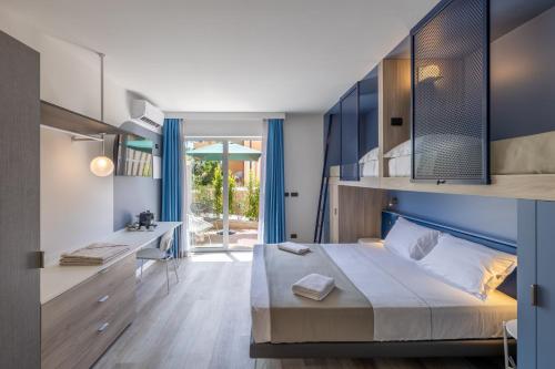 Posteľ alebo postele v izbe v ubytovaní Tuscany Hotel Alle Dune