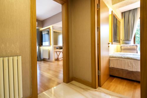 an open door to a bedroom with a bed in it at Lale Hotel in Sapanca
