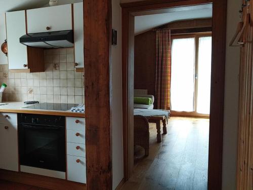 a kitchen with a sink and a stove at Gästehaus Maier in Kitzbühel