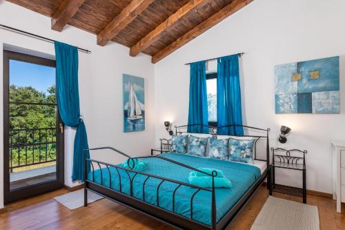 Postel nebo postele na pokoji v ubytování Villa LAVANTINA