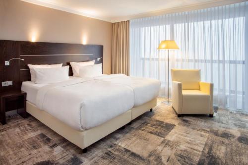 Postel nebo postele na pokoji v ubytování Mercure Hotel Lüdenscheid