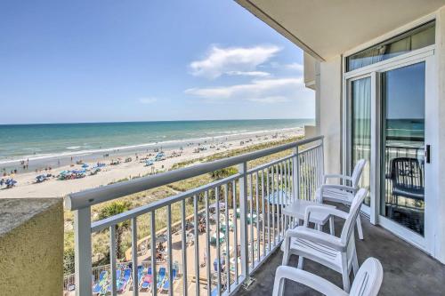 a balcony with chairs and a view of the beach at Bay Watch Condo with Oceanfront Balcony and Beach View in Myrtle Beach