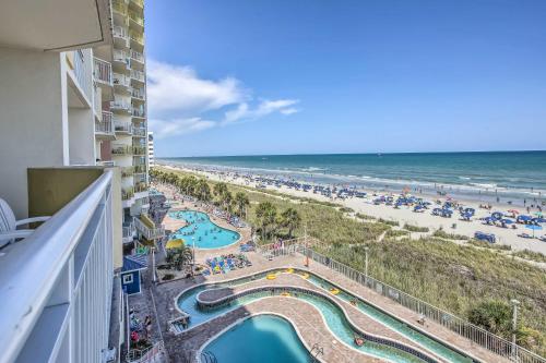 a view of the beach from the balcony of a resort at Bay Watch Condo with Oceanfront Balcony and Beach View in Myrtle Beach