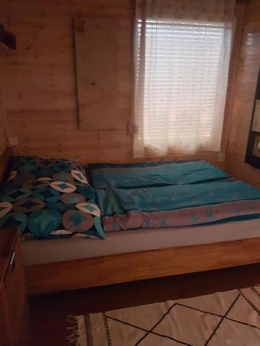 Ein Bett oder Betten in einem Zimmer der Unterkunft Sommerhausrelaxing für gestreßte Menschen