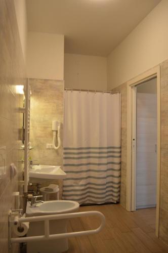 a bathroom with a sink and a shower at Hotel Riva e Mare in Rimini