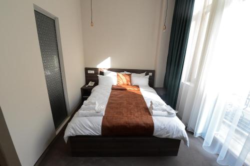 Postel nebo postele na pokoji v ubytování Hotel Cara 28