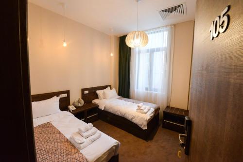 Кровать или кровати в номере Hotel Cara 28
