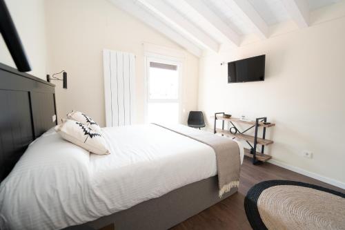 Ένα ή περισσότερα κρεβάτια σε δωμάτιο στο Hotel Rural La Casa de Mis Abuelos