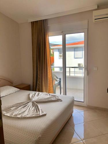 Postel nebo postele na pokoji v ubytování Apartments Ela
