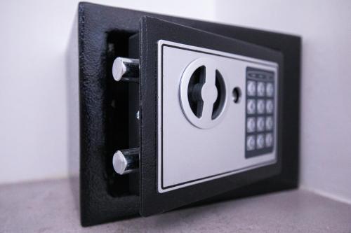 a black and white electrical outlet on a wall at Donnosanto Residence Pantanagianni in Torre Santa Sabina