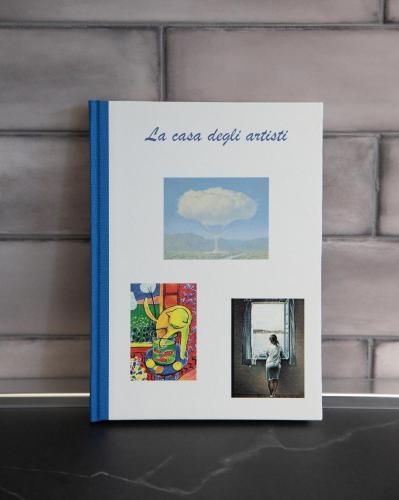 a book sitting on top of a shelf at La CASA DEGLI ARTISTI in Tuscania