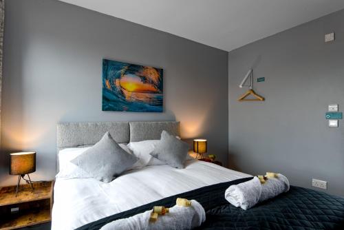 a bedroom with a bed with two stuffed animals on it at The Maelor - Berwyn House in Wrexham