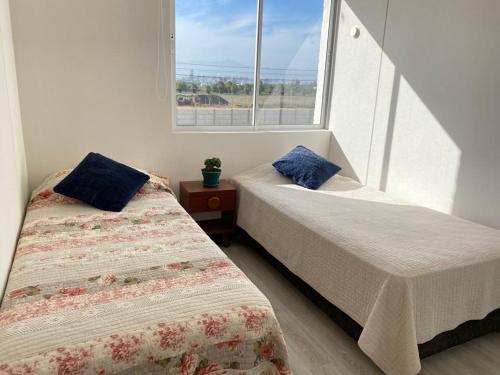 Una cama o camas en una habitación de La Serena Costa