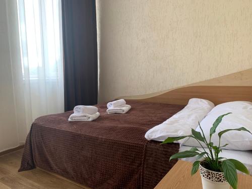 Postel nebo postele na pokoji v ubytování Hotel Femina