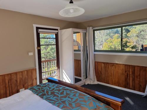 Postel nebo postele na pokoji v ubytování Cradle Alpine Retreat