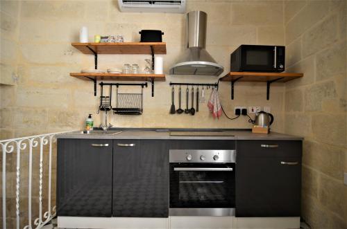 Dapur atau dapur kecil di Città Cospicua suites