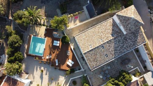 an overhead view of a house with a swimming pool at Dimora Ferralasco in Carloforte