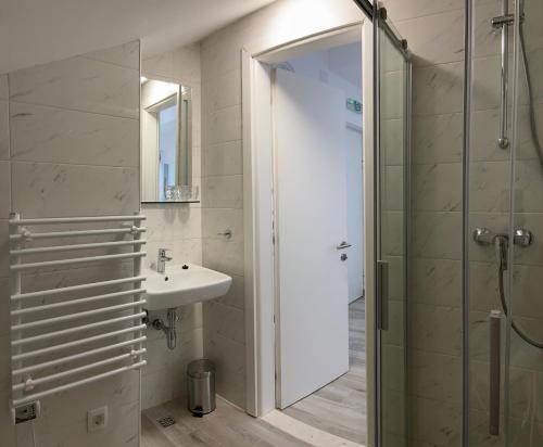 a bathroom with a sink and a shower at Villa OpuZEN in Opuzen