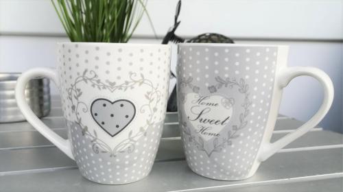 two coffee mugs sitting on a kitchen counter at Zobel Ferienwohnungen in Altenau
