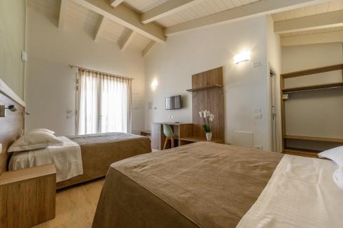 En eller flere senge i et værelse på Terra Fina