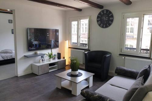 a living room with a couch and a table at - 2 - Très Bel Appart Charmant et Moderne 5Pers T3 73m2 in Sélestat