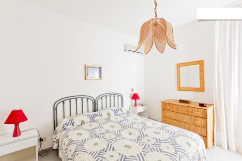 Posteľ alebo postele v izbe v ubytovaní Villetta a 10 minuti, a piedi, dalla spiaggia