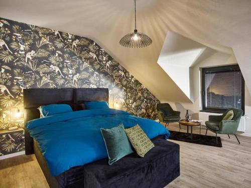 Postel nebo postele na pokoji v ubytování Inviting Holiday Home in Vlijtingen with Sauna