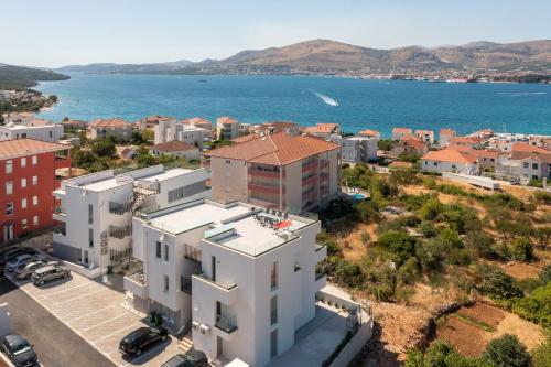 an aerial view of a city and the ocean at Luxury Apartment Dreams in Okrug with swimming pool, sea view, Wifi, parking in Trogir