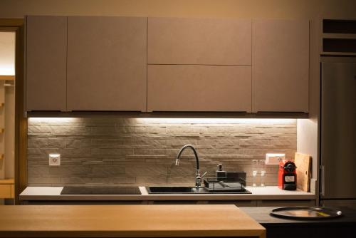 a kitchen with a sink and a counter top at Sweet Villas in Lygia