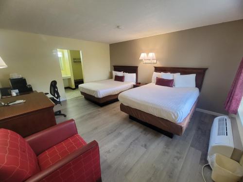 Postel nebo postele na pokoji v ubytování Elk Inn Motel