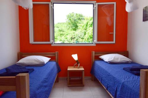 Postel nebo postele na pokoji v ubytování La Villa Timarys