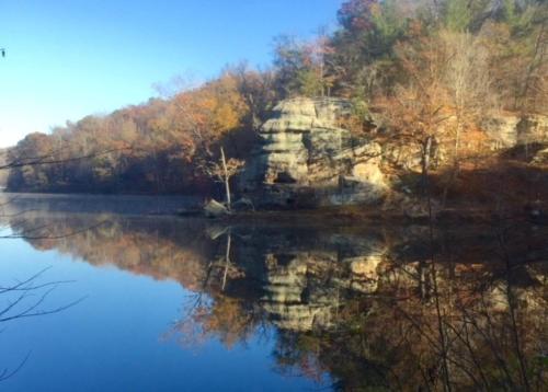 a reflection of a mountain in the water at Holiday Inn Express & Suites Ironton by IHG in Ironton