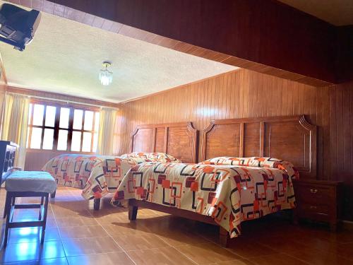 Postel nebo postele na pokoji v ubytování Posada Castillo