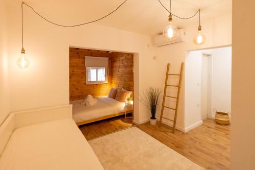 a bedroom with a bed and a brick wall at Eilat vacation house דירות נופש אילת in Eilat