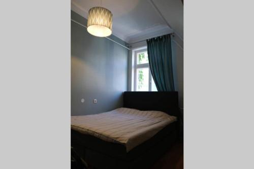 Postel nebo postele na pokoji v ubytování Apartment with charm in Pärnu Old Town
