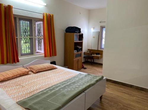 Voodi või voodid majutusasutuse Yelagiri Villa toas