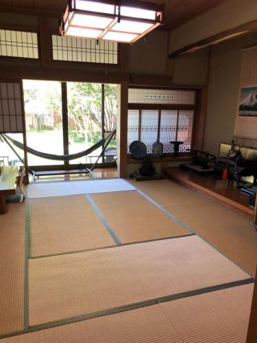 a tennis court with a net in a room at STAY FUJI a in Yamanakako